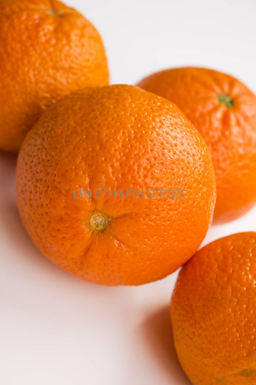 Vibrant mandarin fruit on a white background.