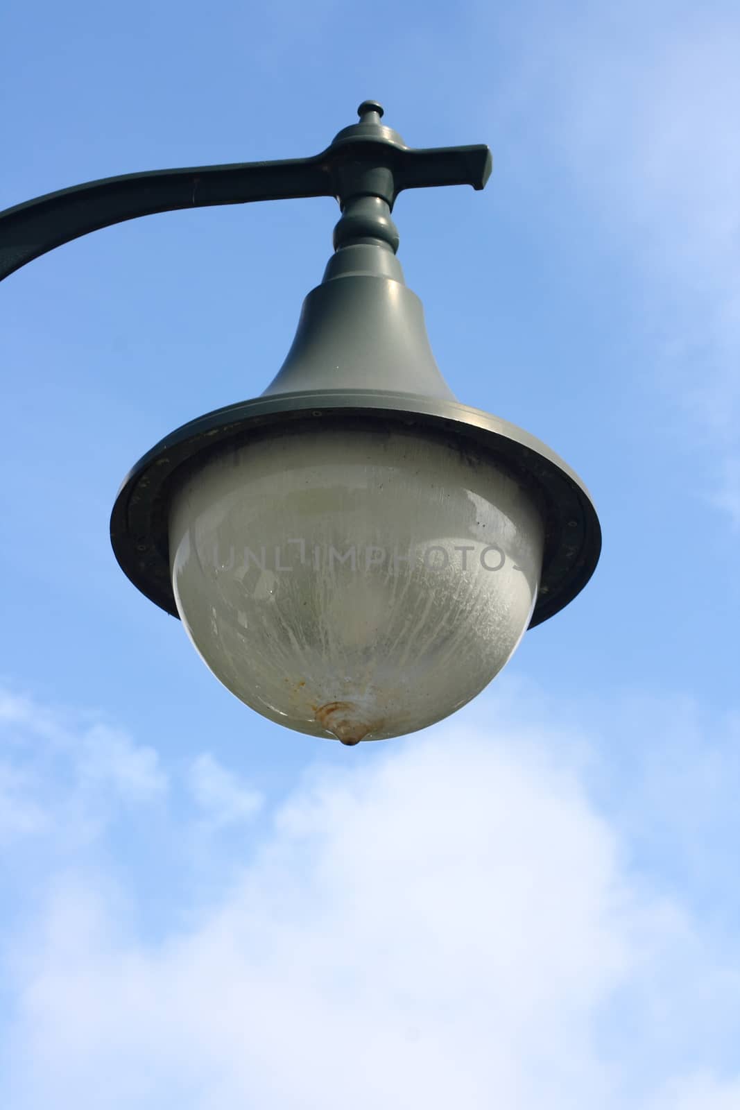 a street lamp with a large, spherical glass body