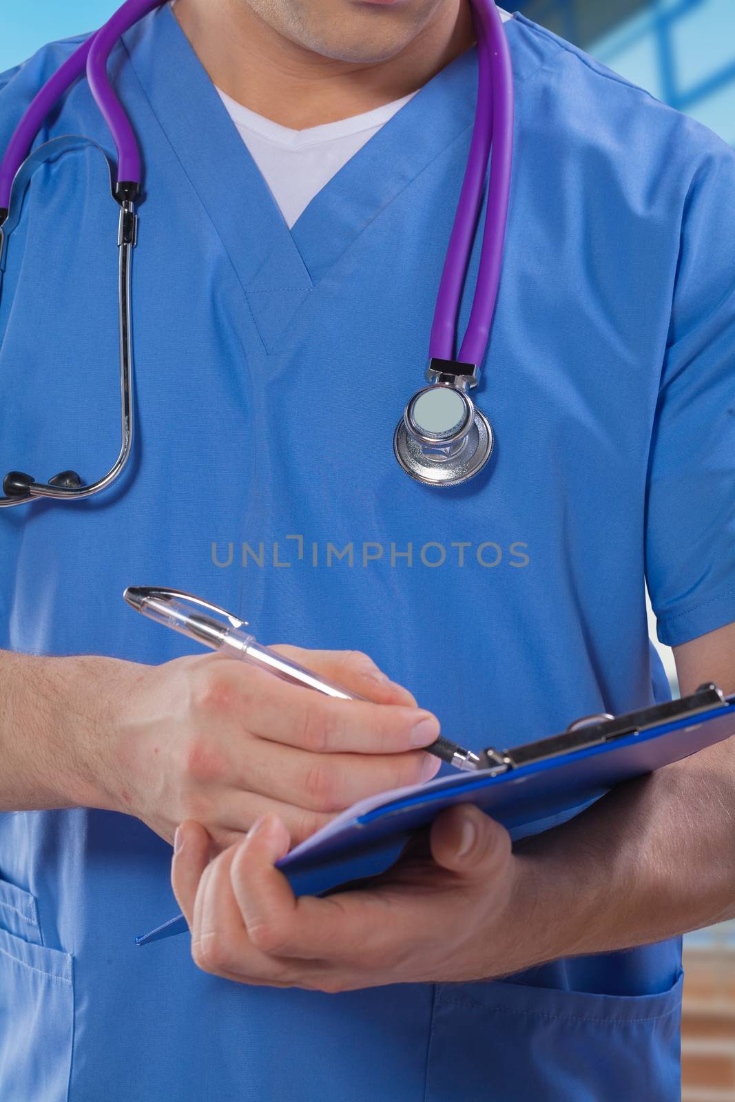 a doctor writing in clipboard