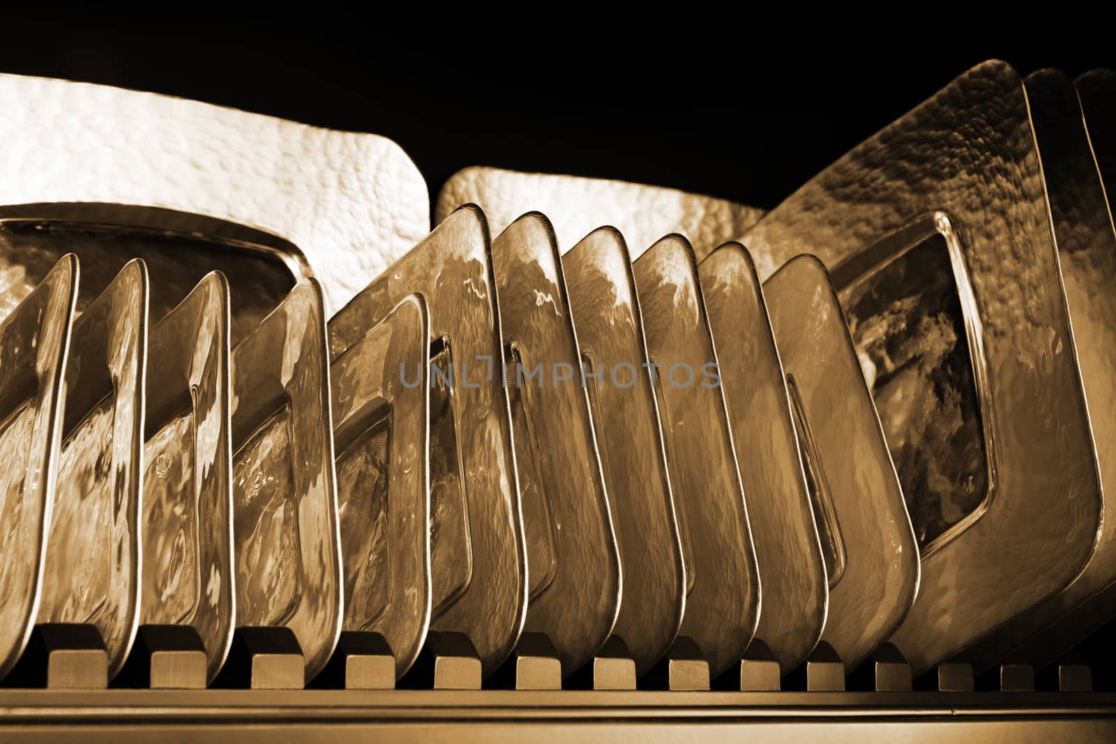 Beautiful glass plates on a metal shelf