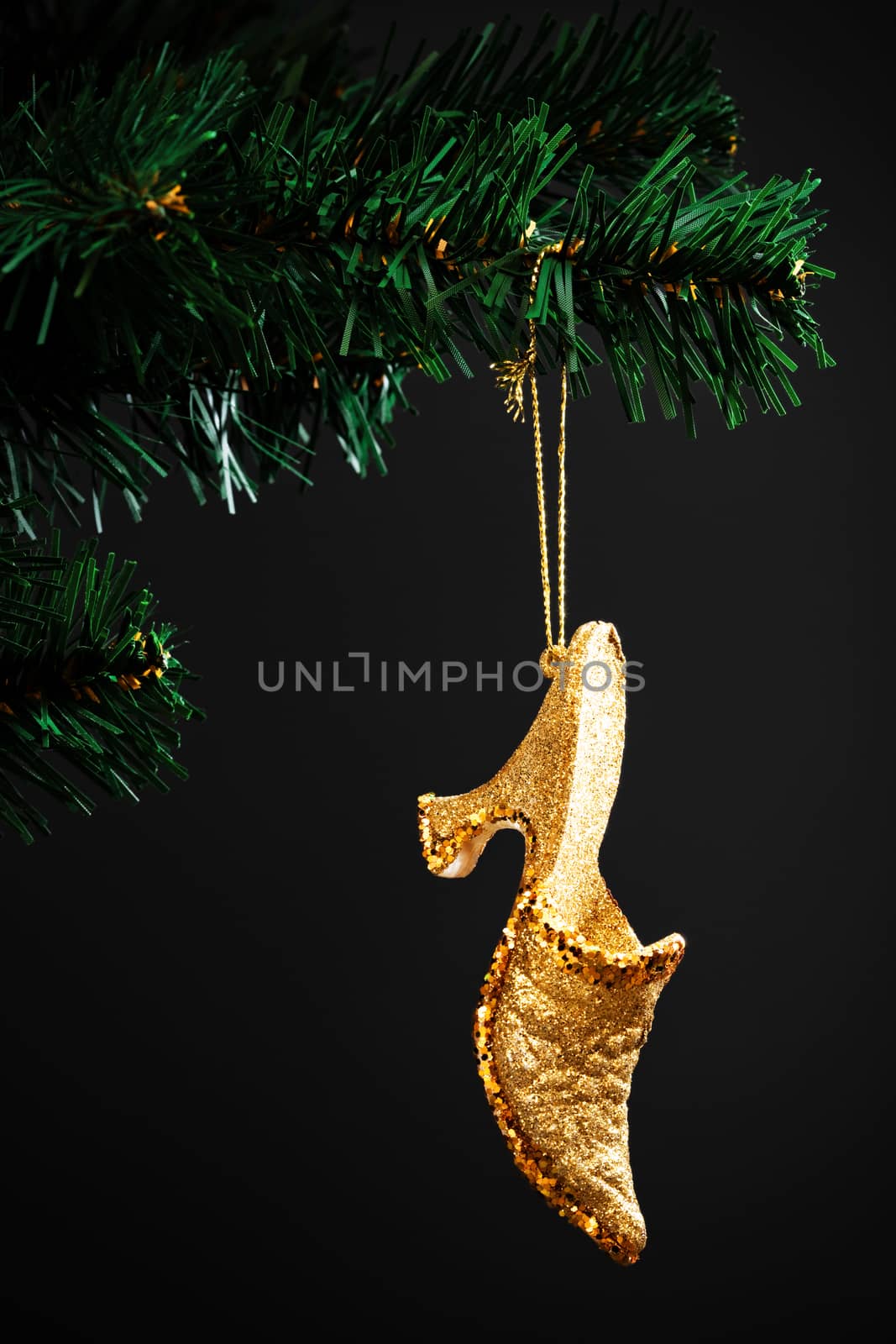 gold shoe on the artificial Christmas tree
