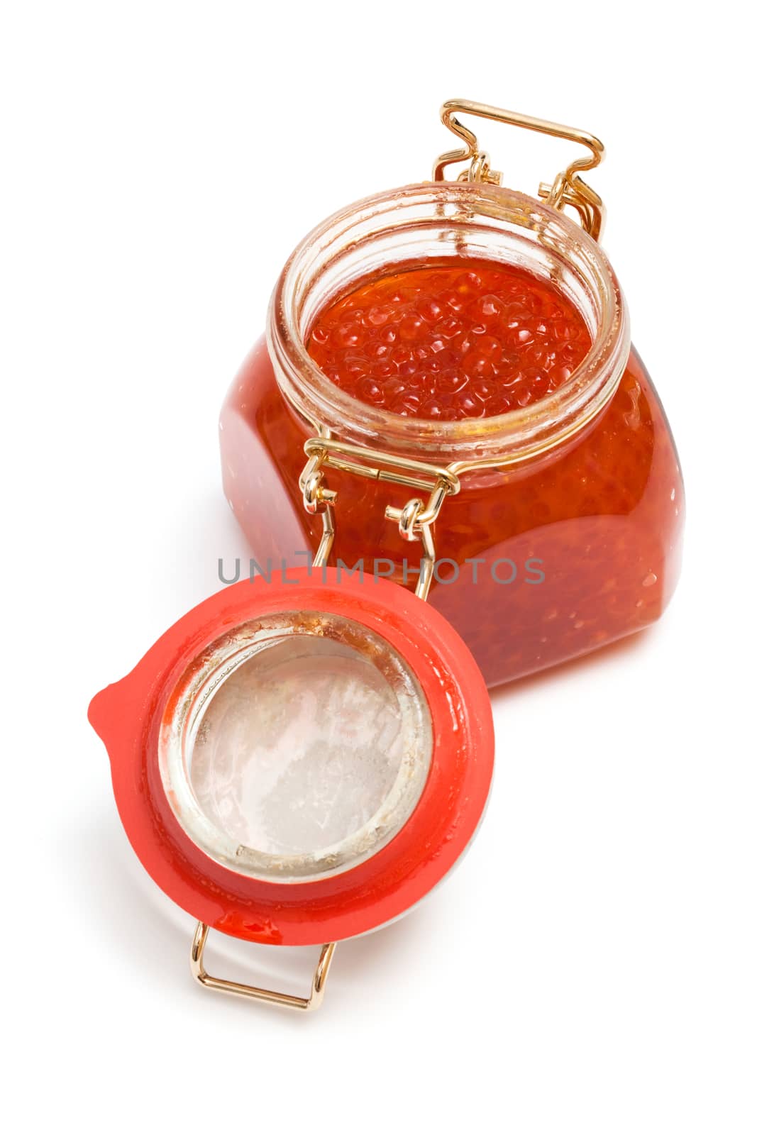 Red caviar in glass jar on a white background