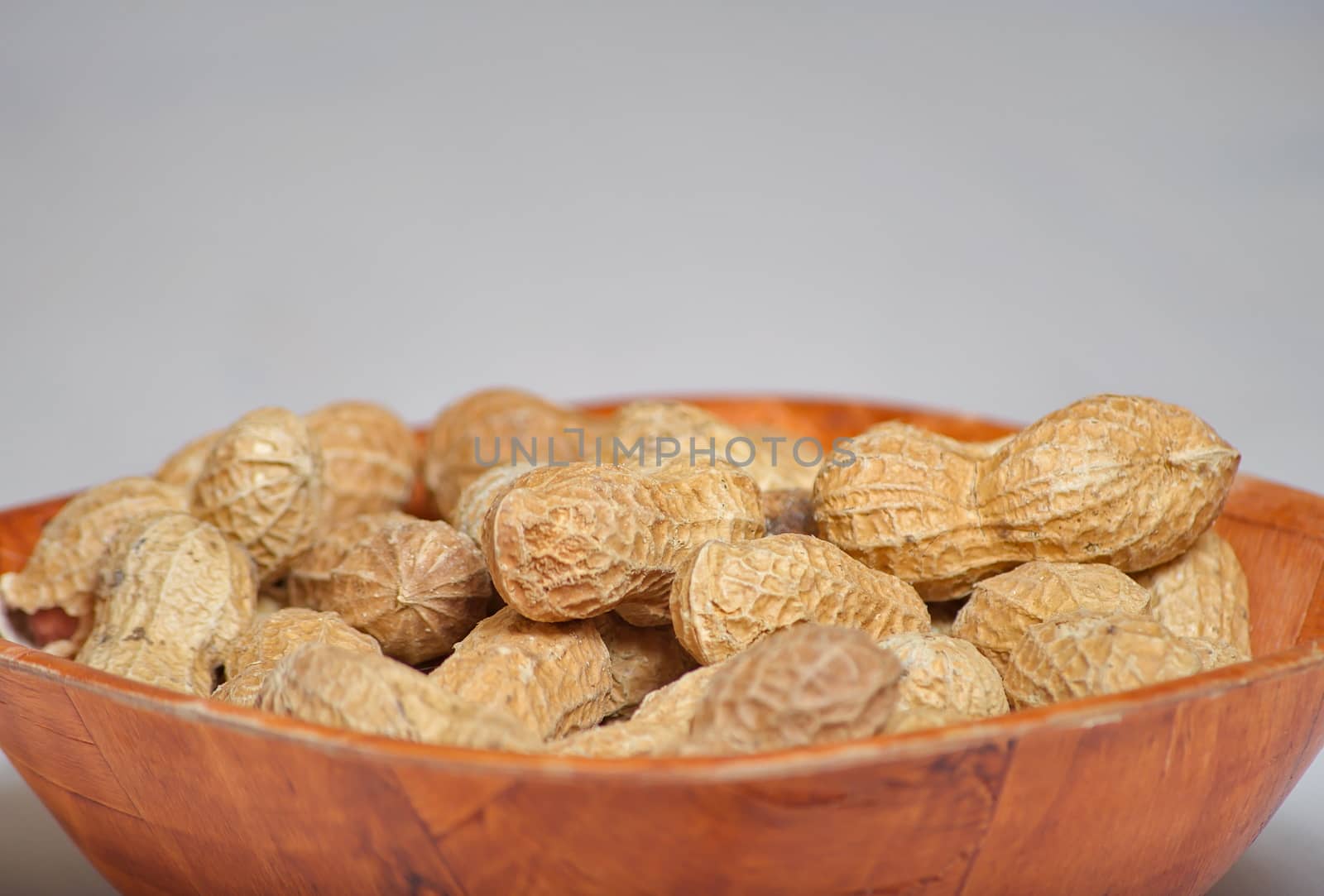 Peanuts in a brown bowl