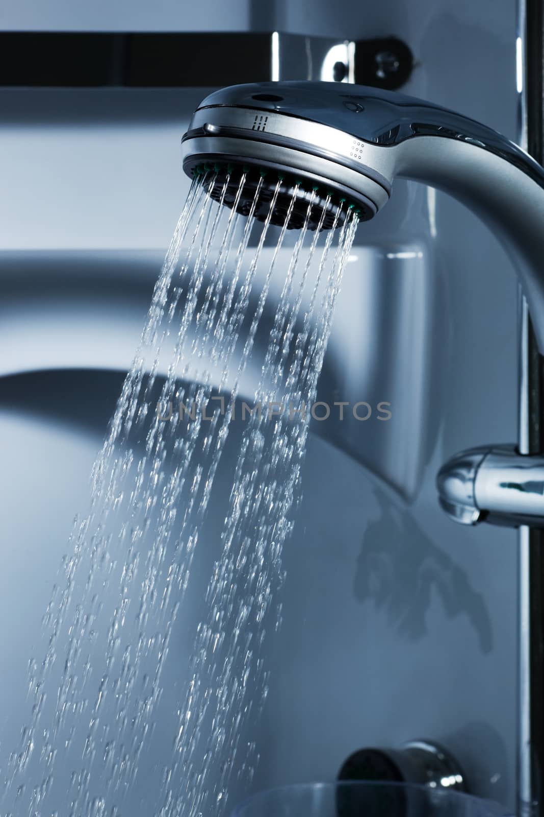 Water from the shower in the modern bathroom