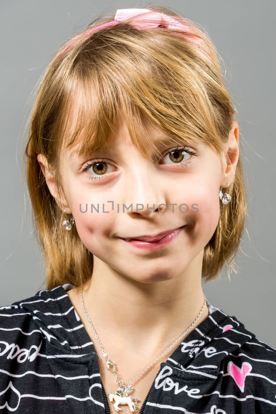 Studio portrait of young beautiful girl with nice eyes on black