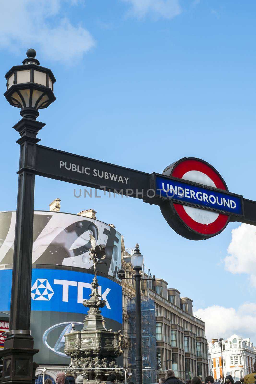 LONDON, UK - MARCH 14: Underground entrance with light of famous Piccadilly Circus corner. March 01, 2014 in London.