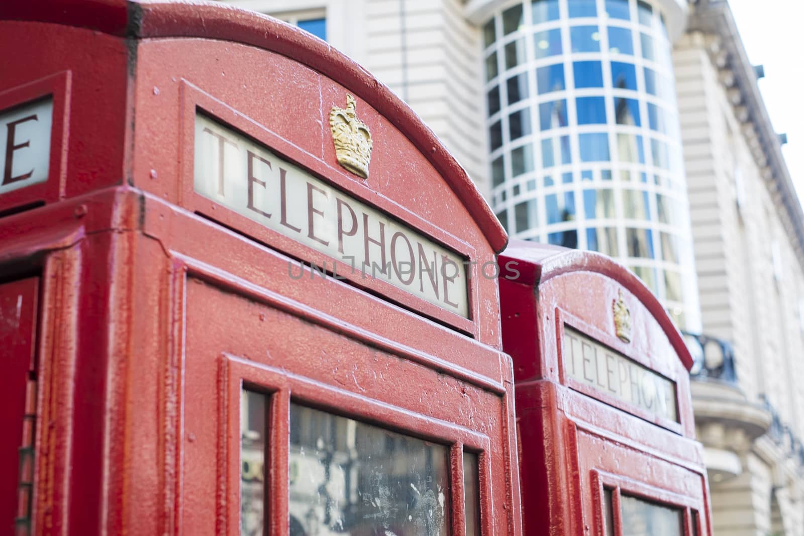 Detail of old red telephone booth in London, UK