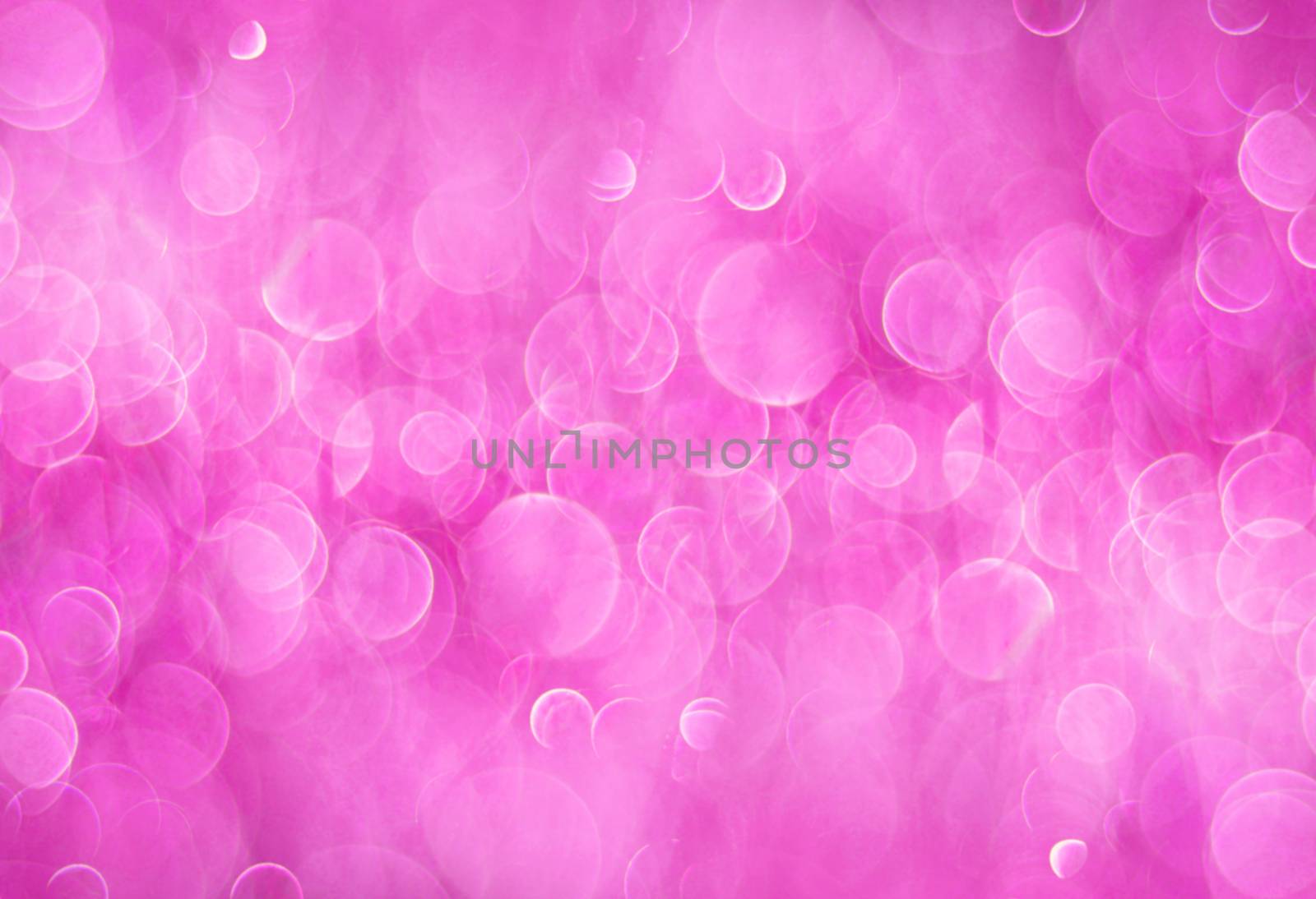 Pink abstract background with bokeh circles