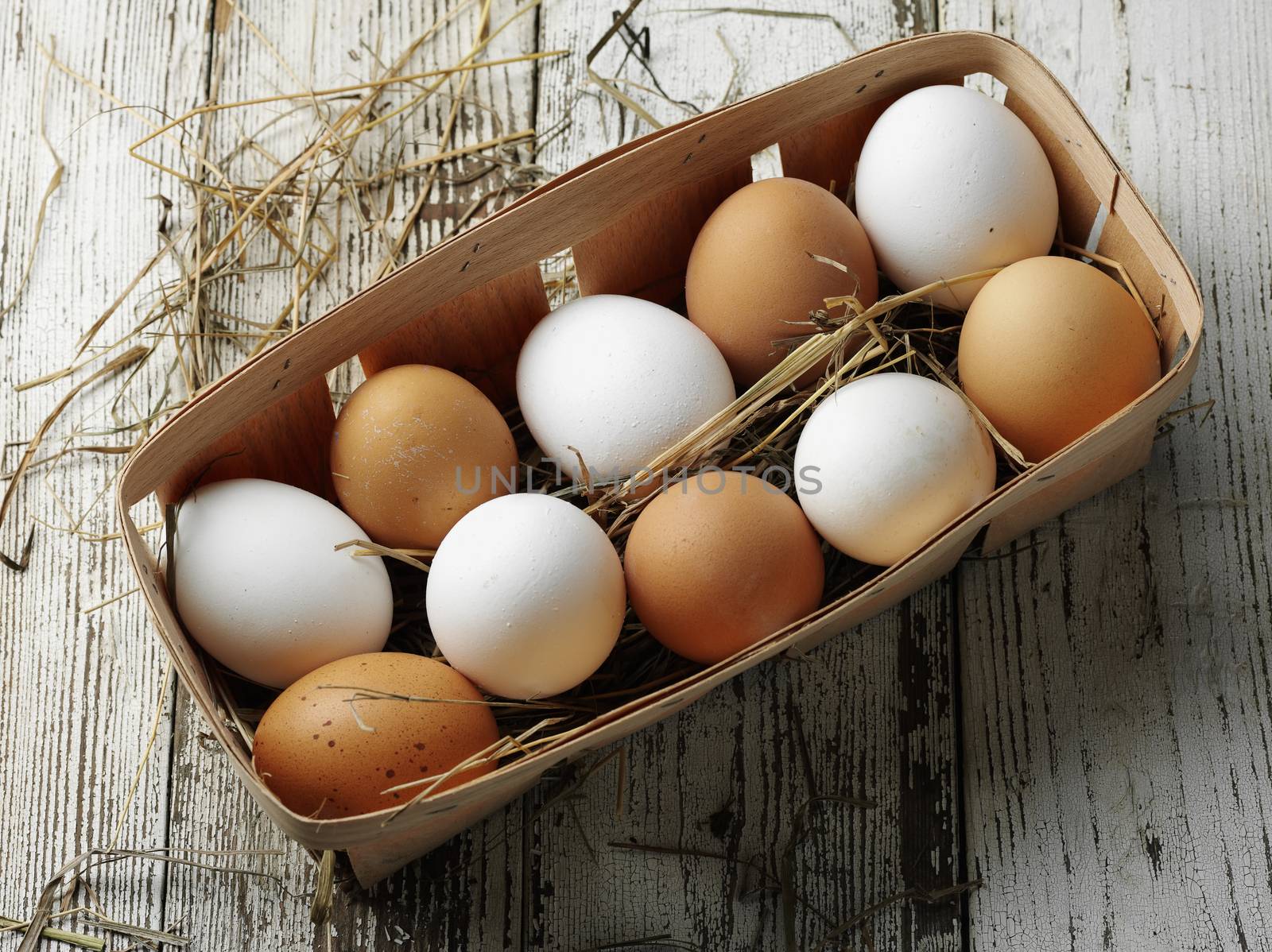 raw chiken eggs in the wooden box
