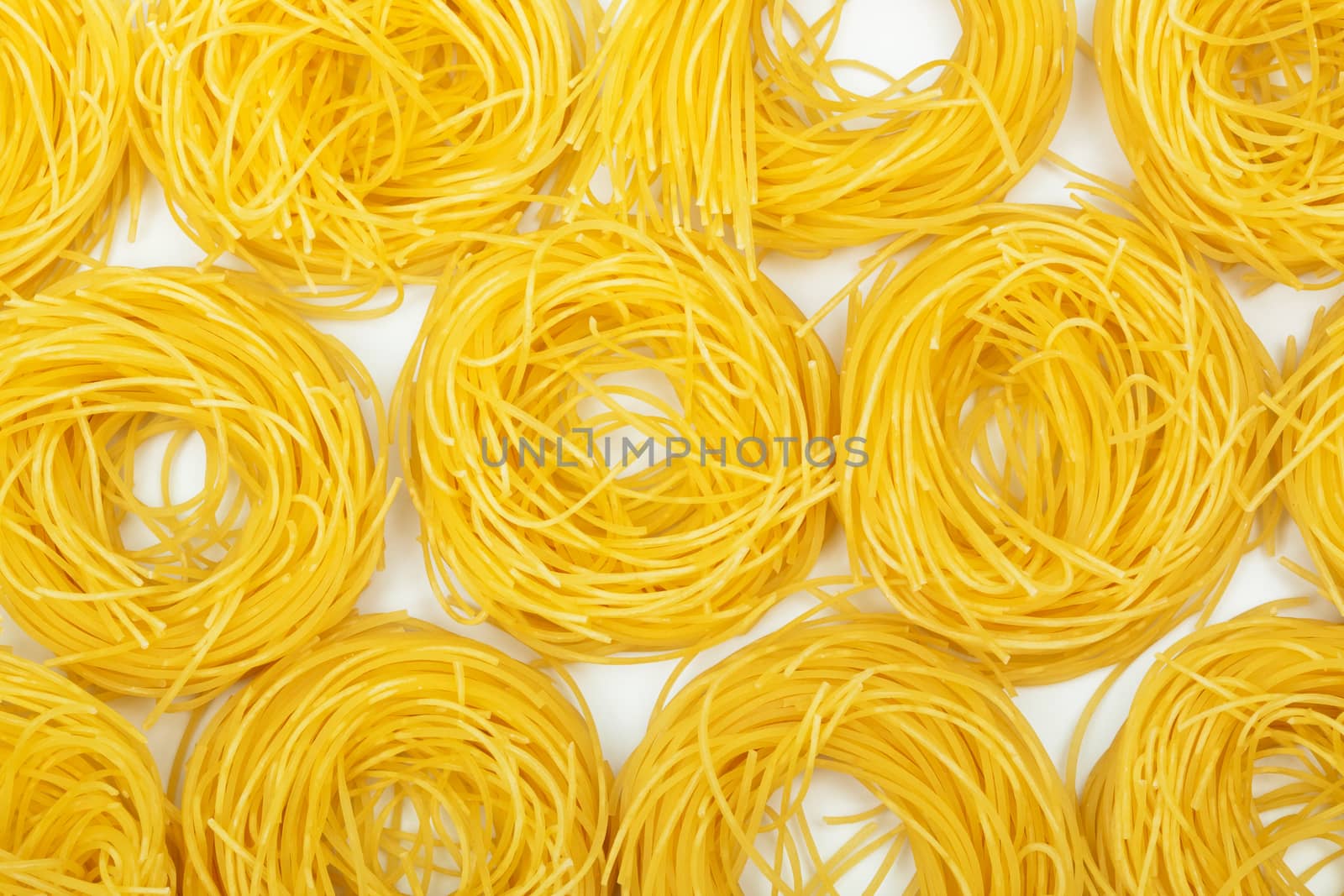 Yellow and beautiful pasta close-up as a background