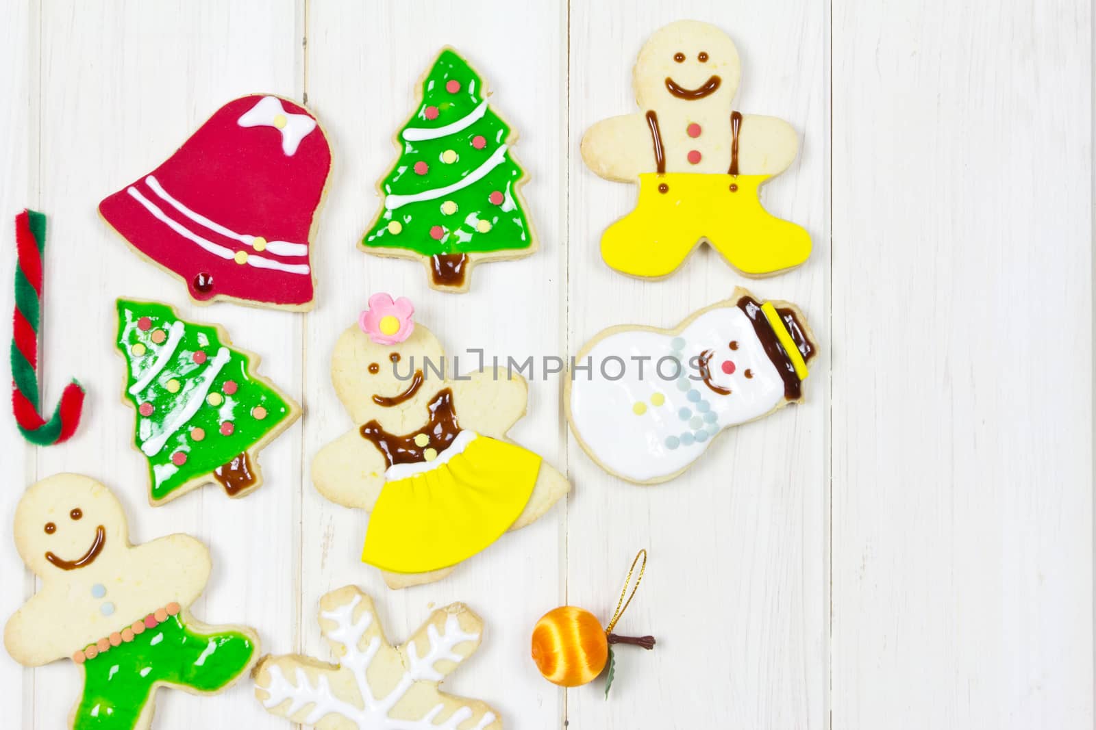 Cookies decorated with a Christmas theme on wood background