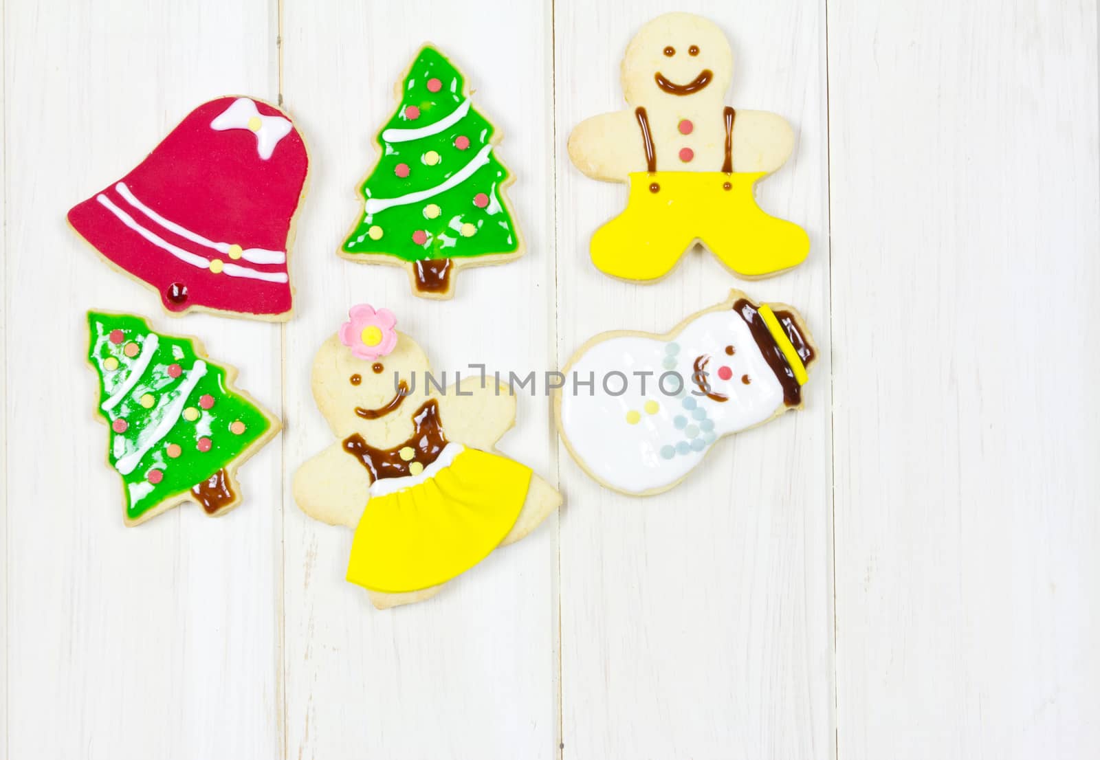 Gingerbread cookies on wood background