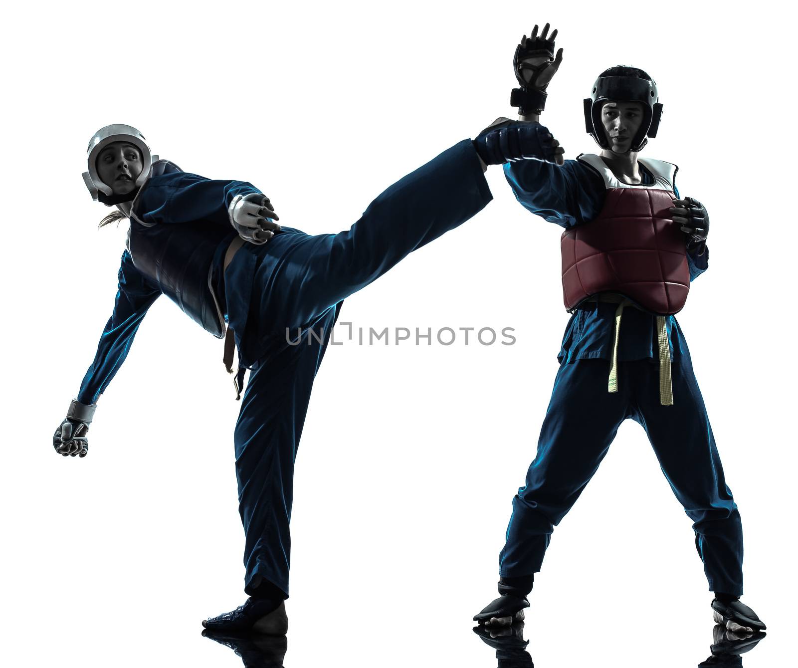 one caucasian man exercising martial arts in silhouette studio isolated on white background