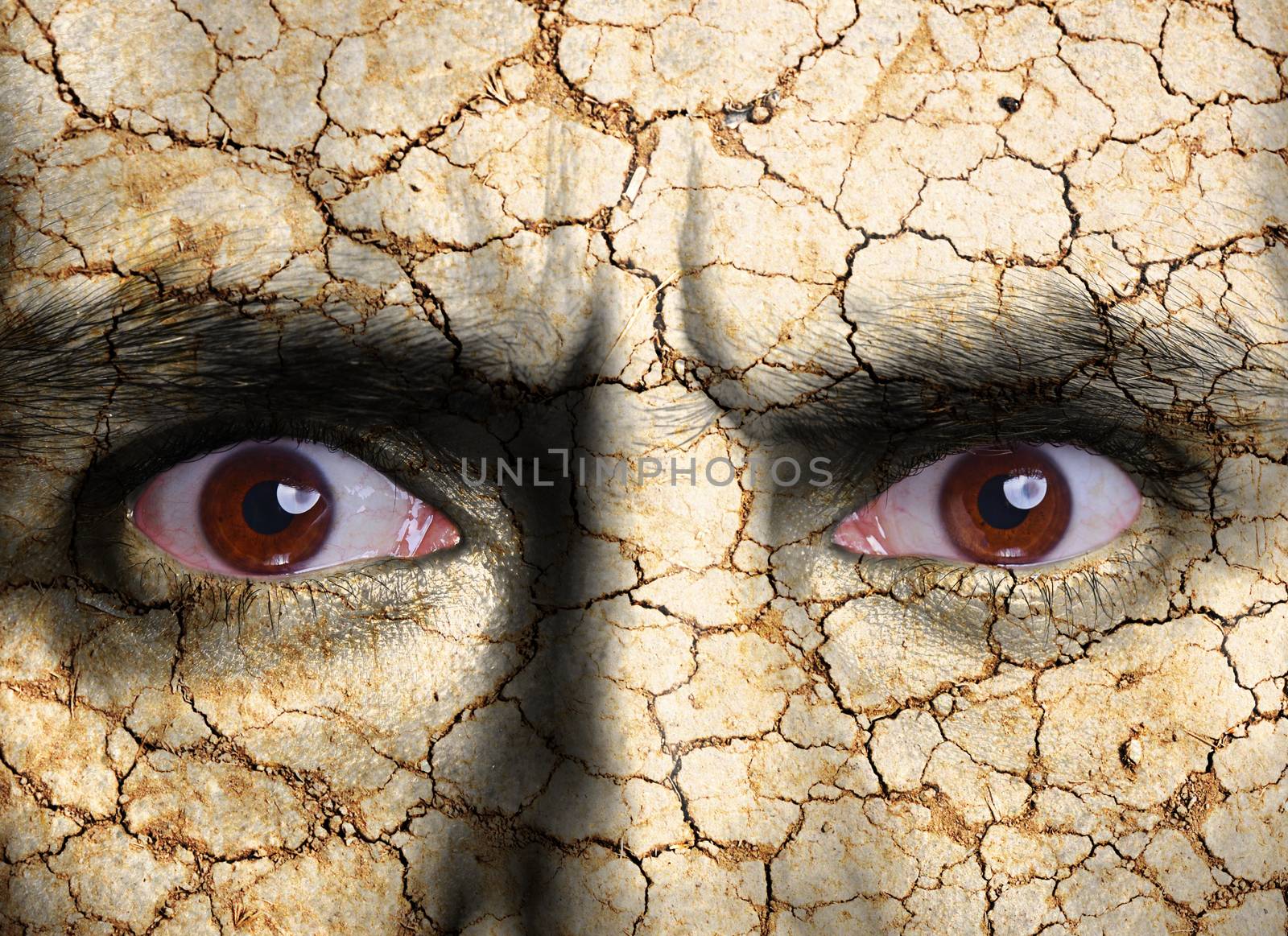 Beauty concept - face covered with cracked surface - symbol of dry skin