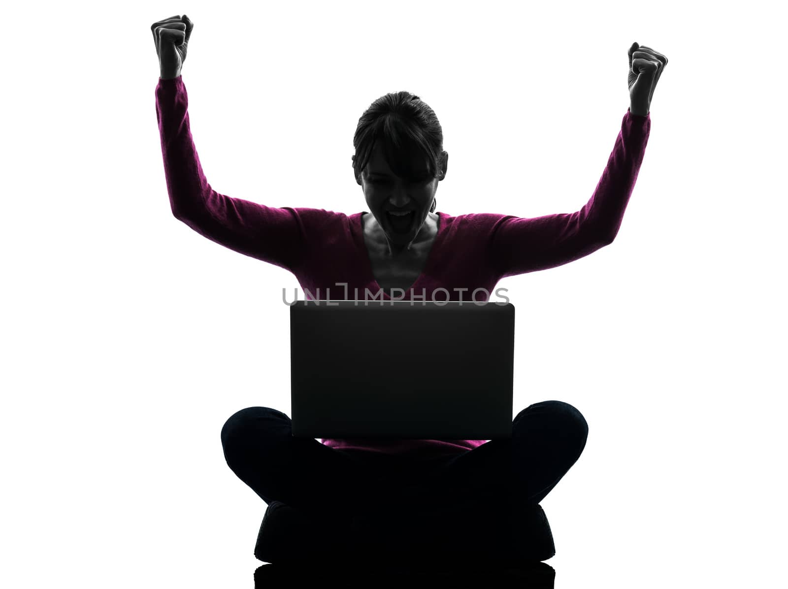 one caucasian woman happy winning computing laptop computer in silhouette studio isolated on white background