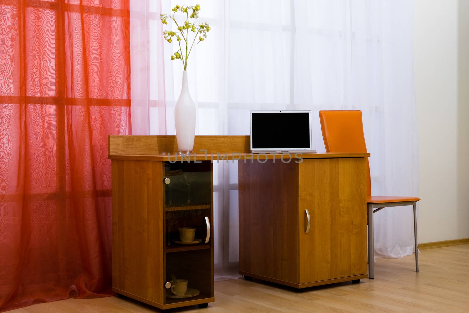 New and modern laptop on a table in an apartment