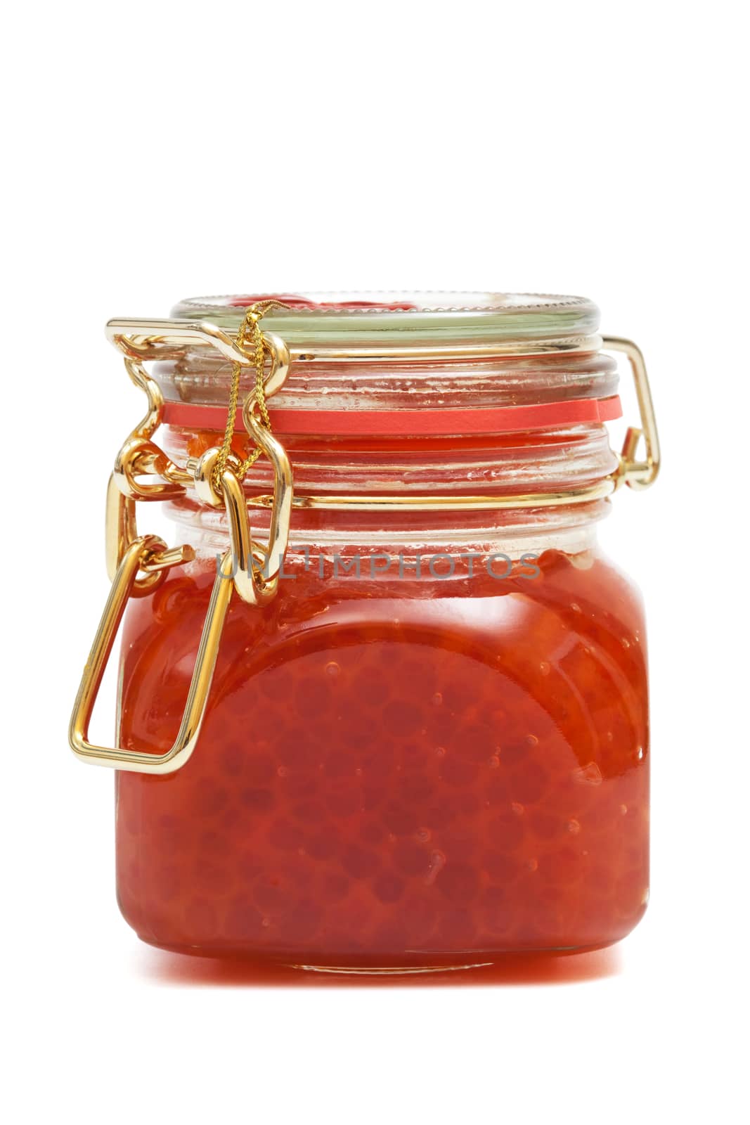 Red caviar in glass jar on a white background