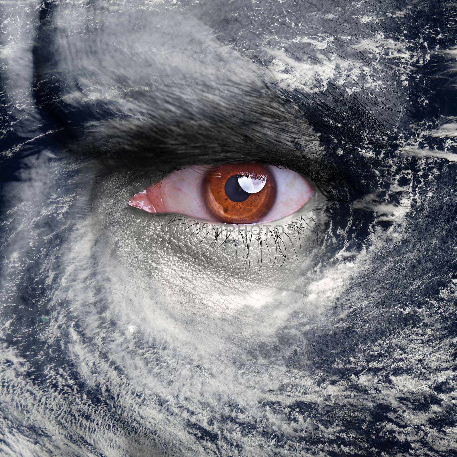 A blue eye in the middle of a tropical hurricane. Elements of this image furnished by NASA