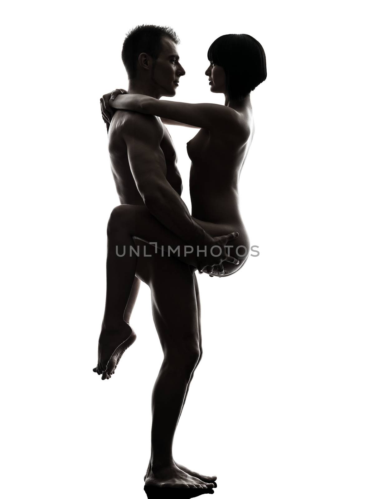one caucasian couple man woman sexual kamasutra posture love activity in silhouette studio on white background