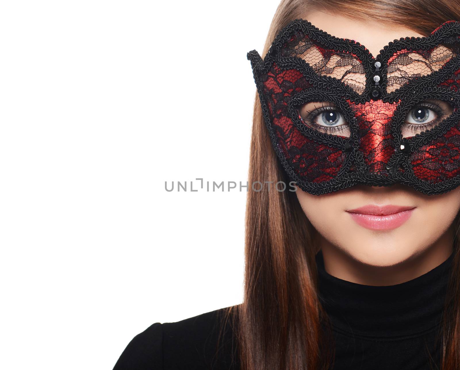 Beautiful woman in carnival mask over white background
