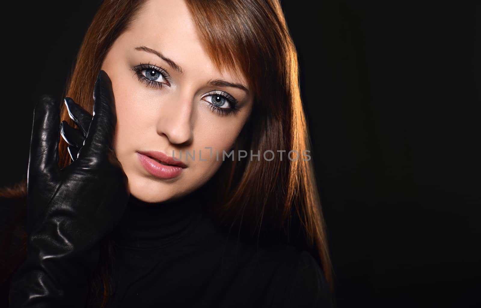 Beautiful caucasian brunette over black background