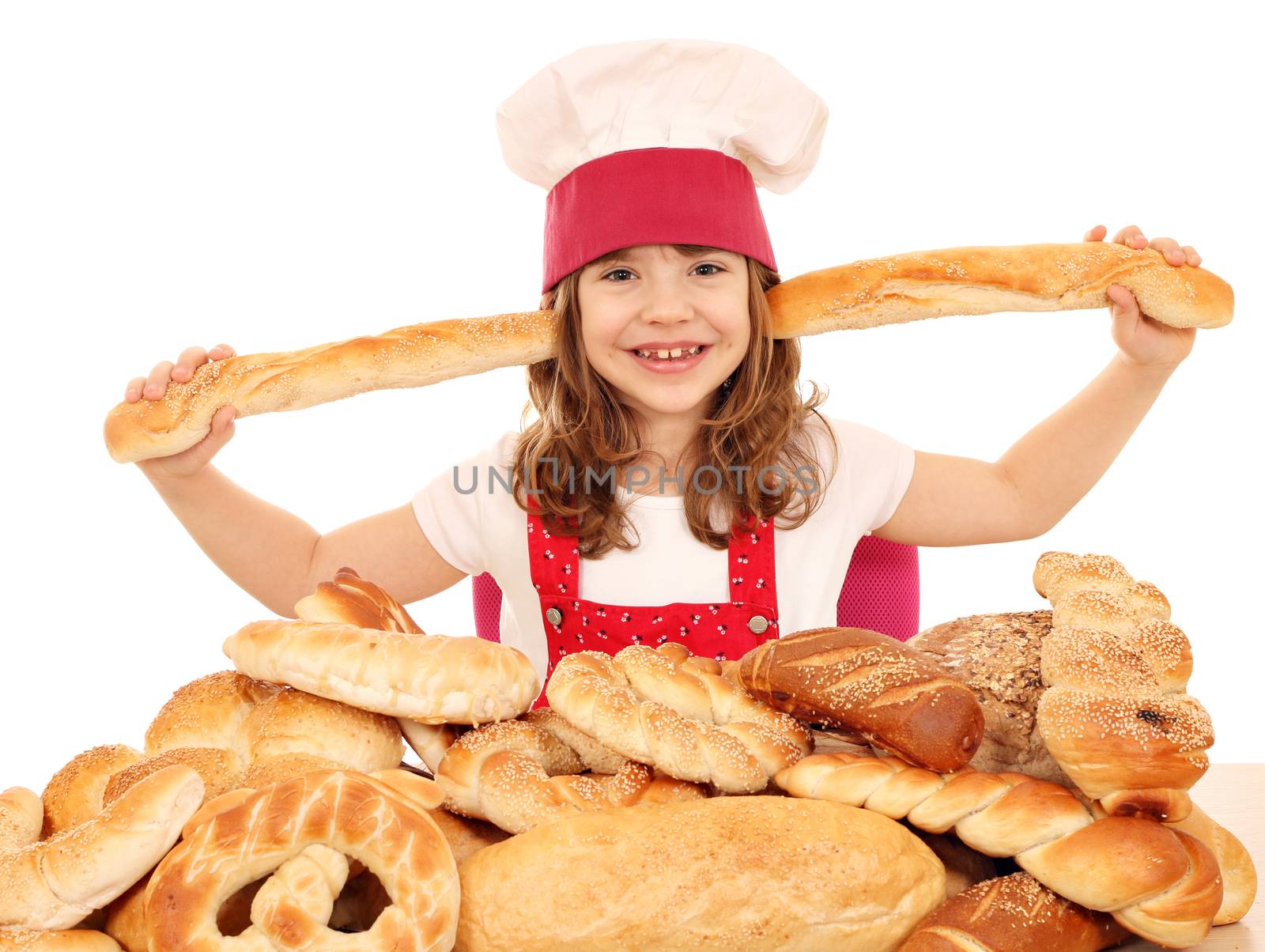 happy little girl cook with bread and pastry