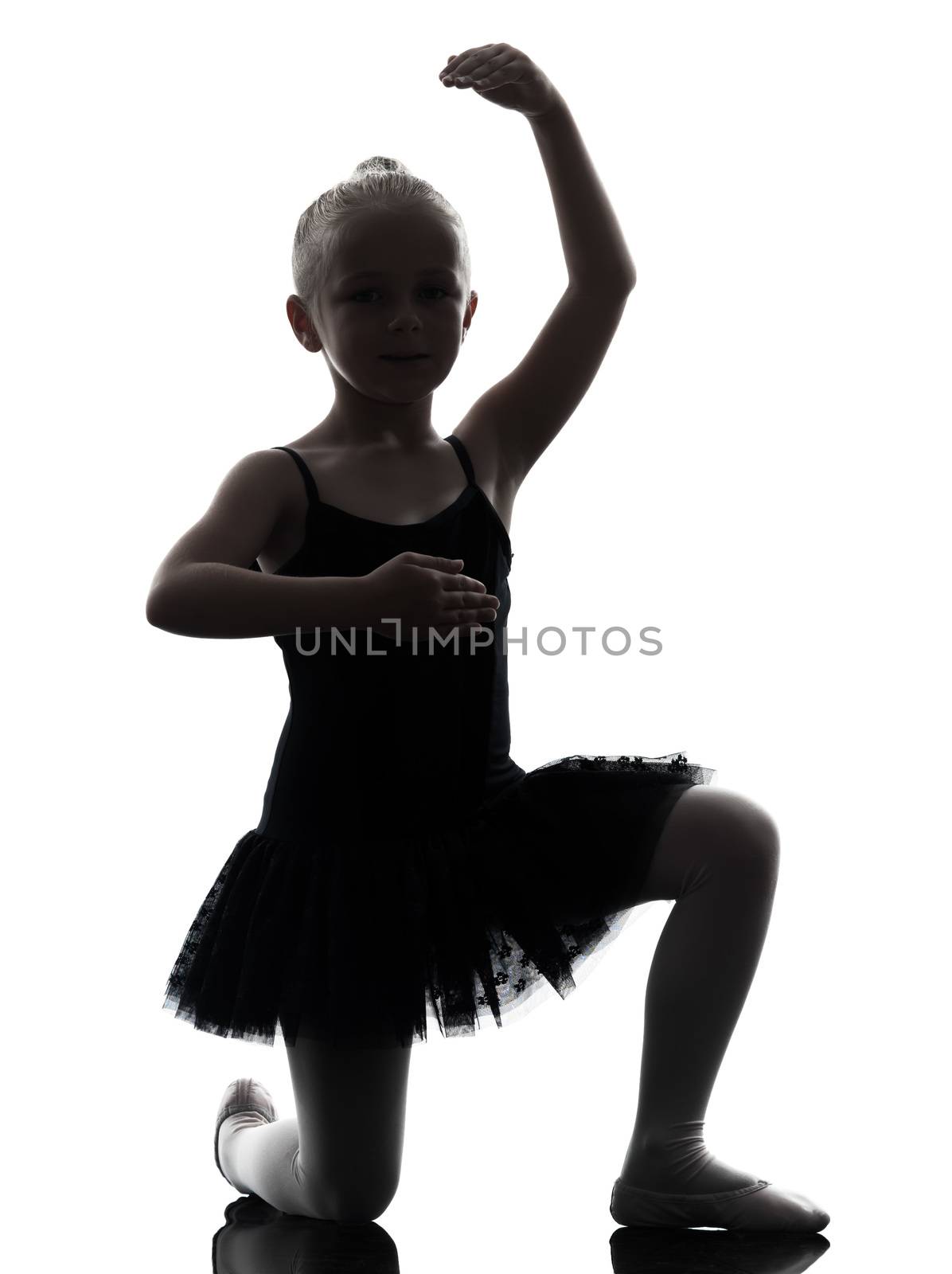 one little girl ballerina ballet dancer dancing in silhouette on white background