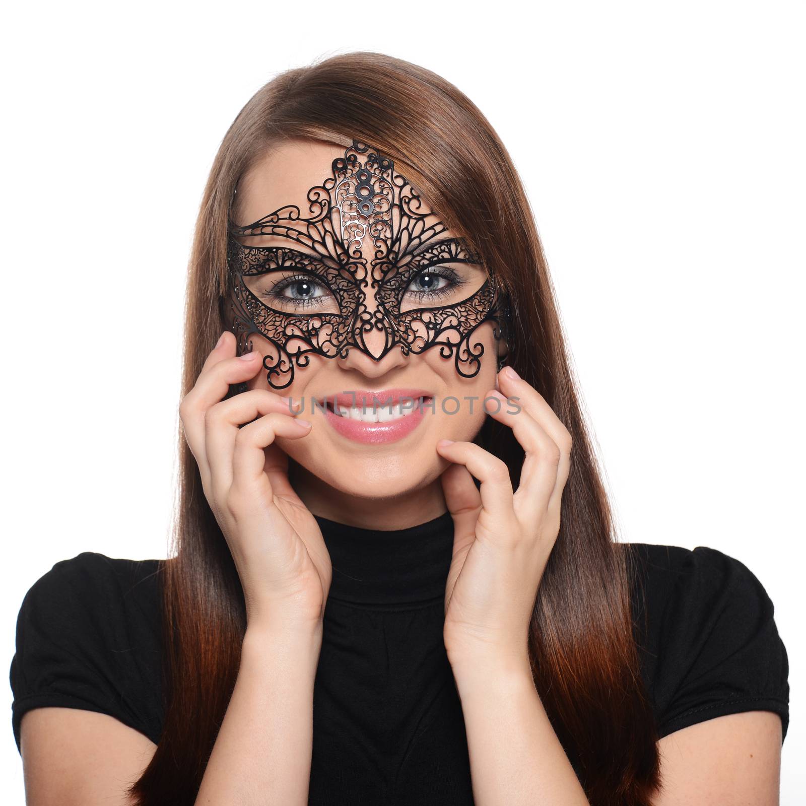 Beautiful caucasian brunette in carnival mask over white background
