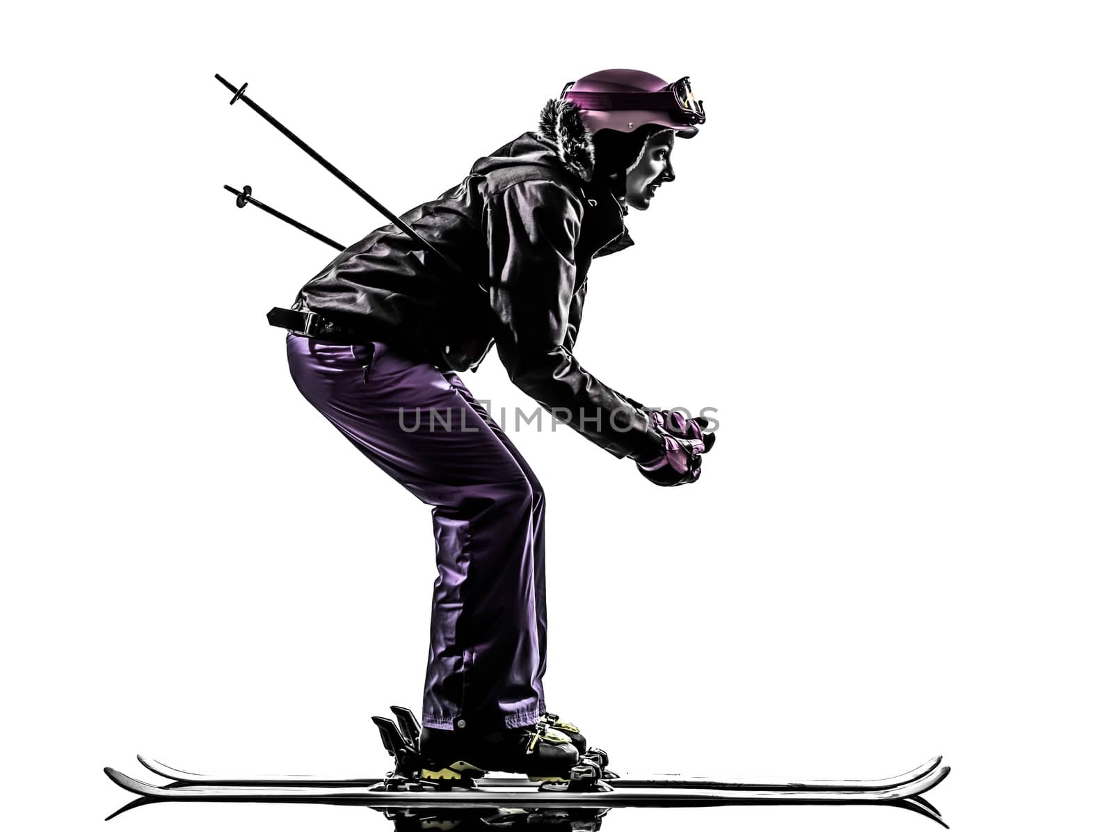 one caucasian woman skier skiing in silhouette on white background
