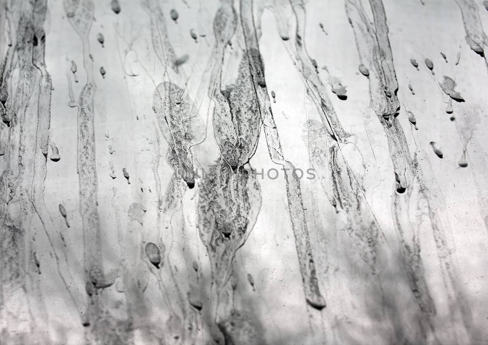 Abstract background in the form of a shapeless liquid drips on a transparent background