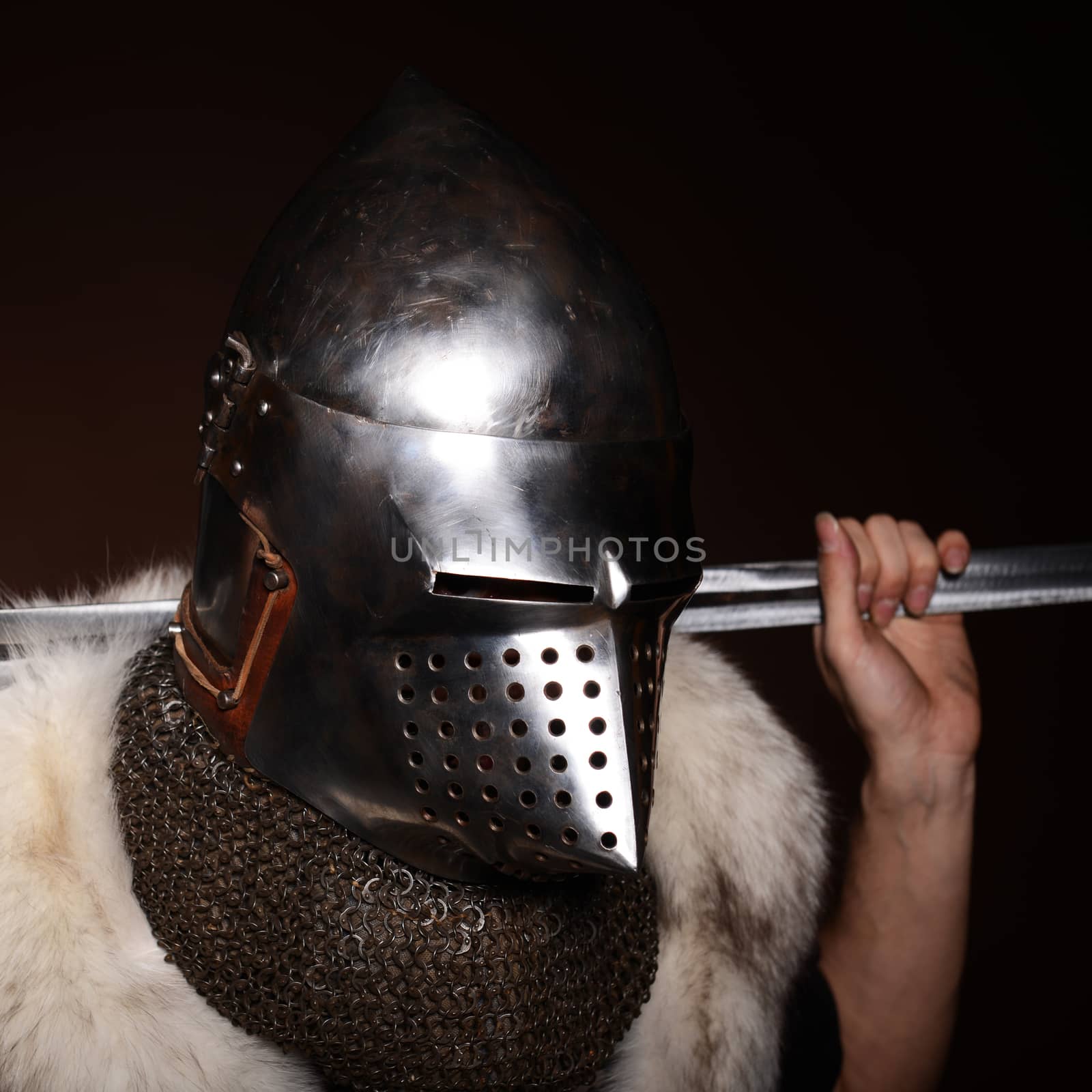 Portrait of XV century knight on dark background
