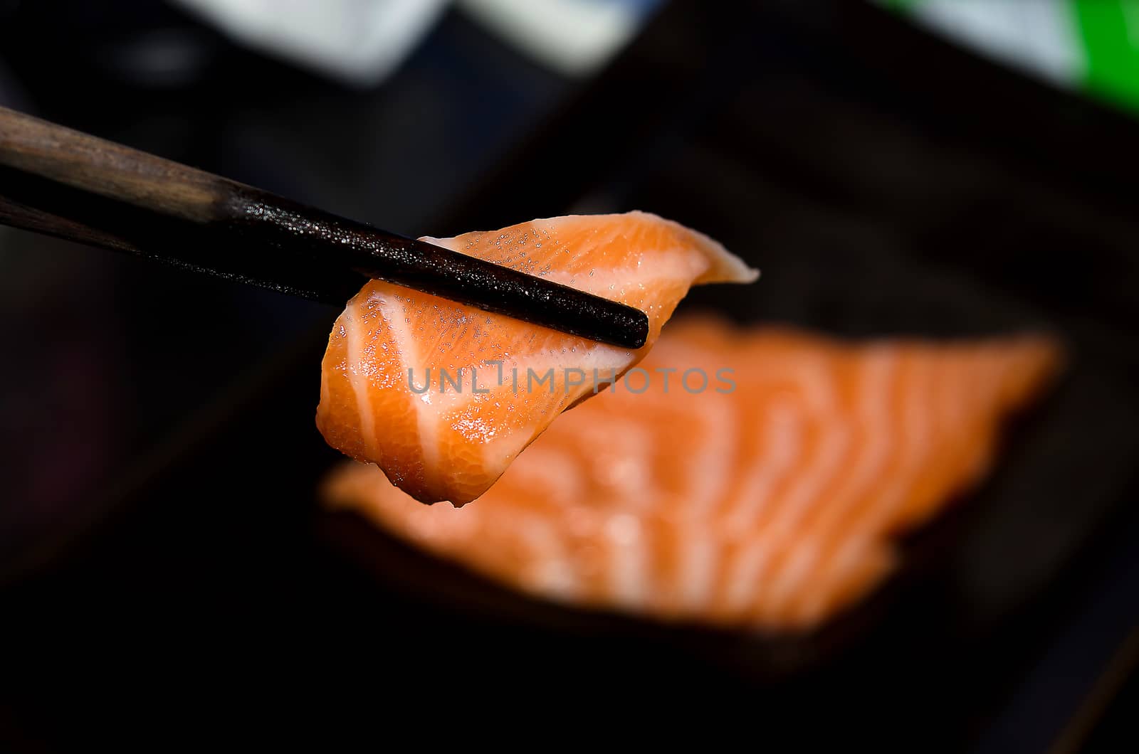 Fresh salmon fillets isolated the black background.