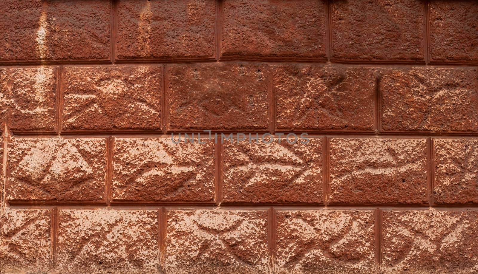 Fragment of old decorative finishes on the wall of an apartment house