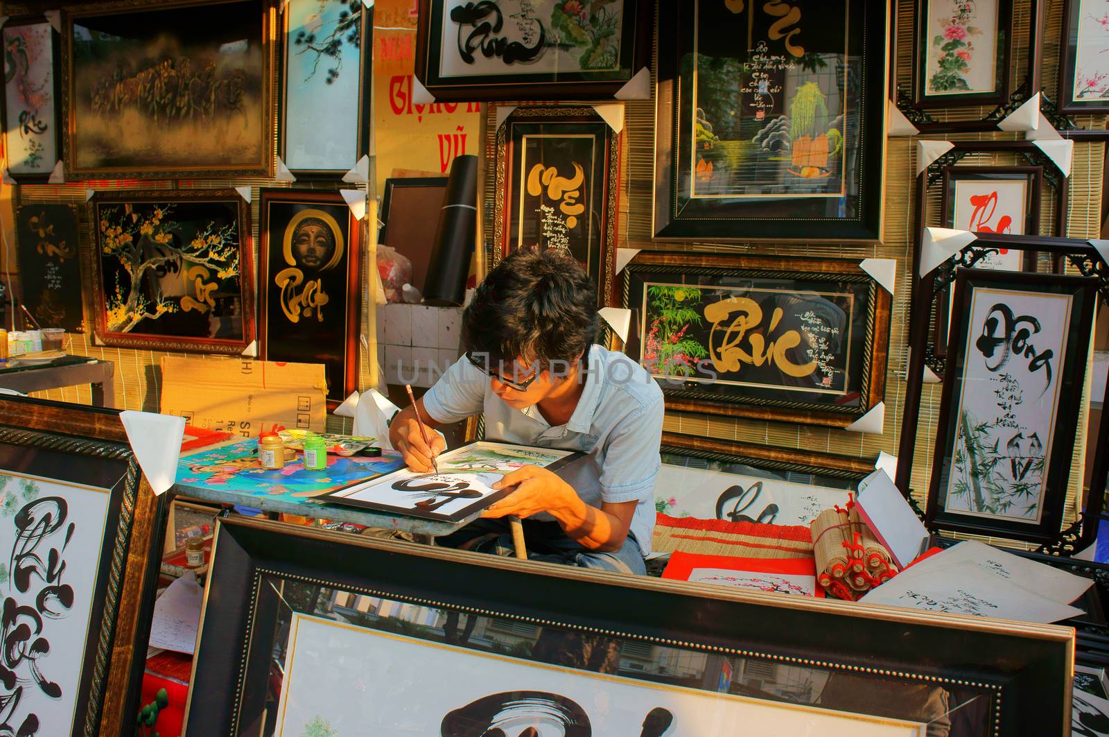 SAI GON, VIET NAM- FEBRUARY 1, 2013. People writing calligraphy at fair, this is traditional culture of Vietnamese in springtime, Sai gon, VietNam on February 1, 2013