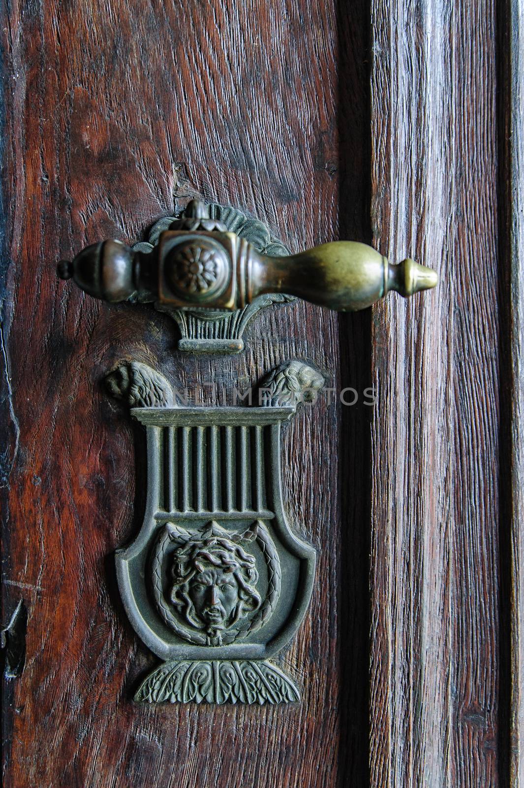 Vintage doorknob on a wooden antique door
