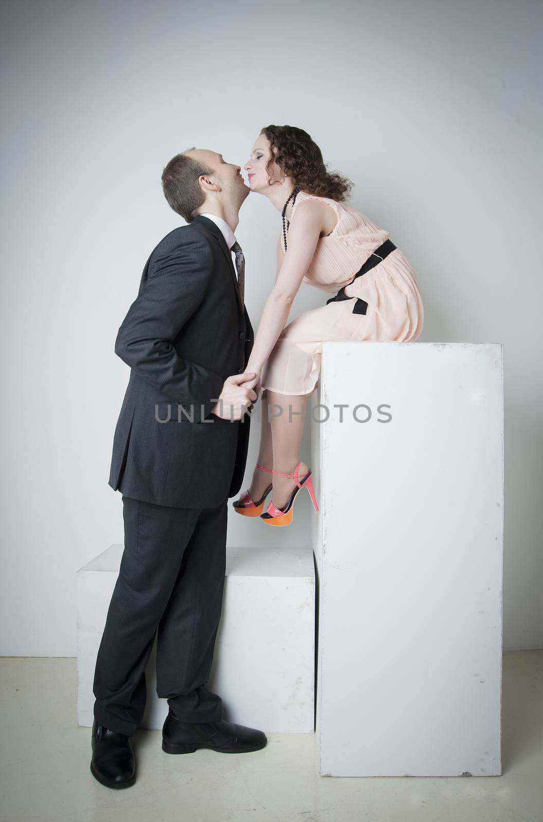 young man and woman look at each other in the Studio
