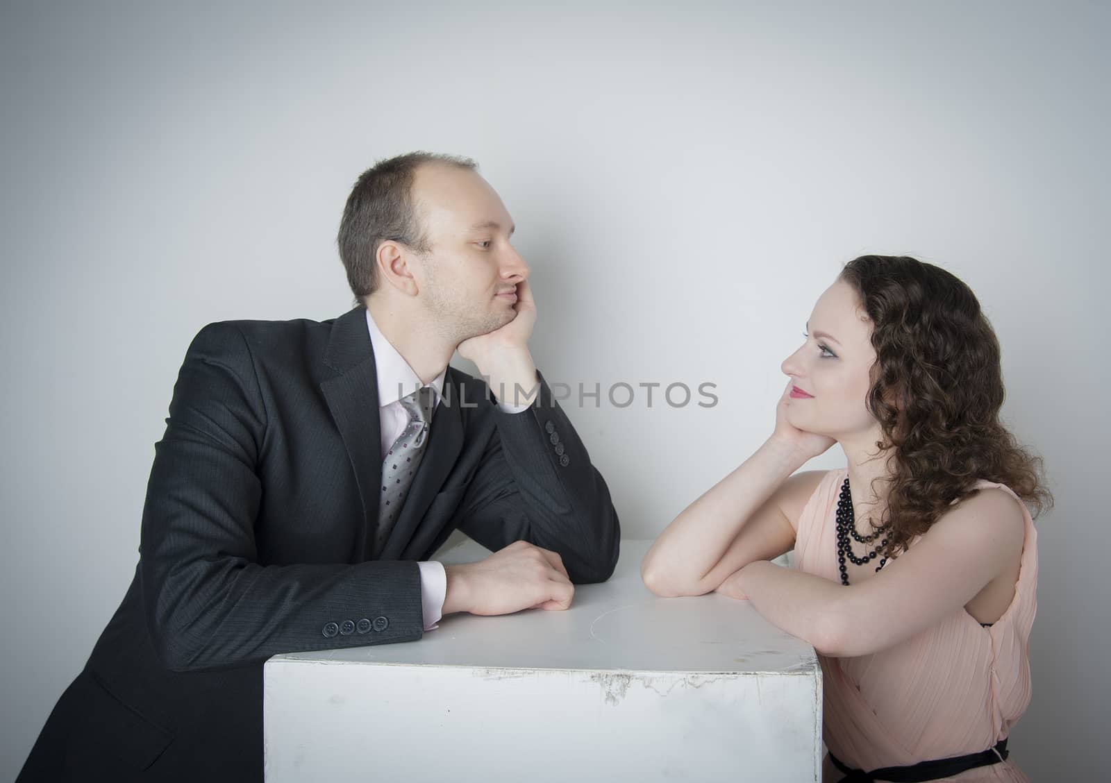 young man and woman look at each other in the Studio