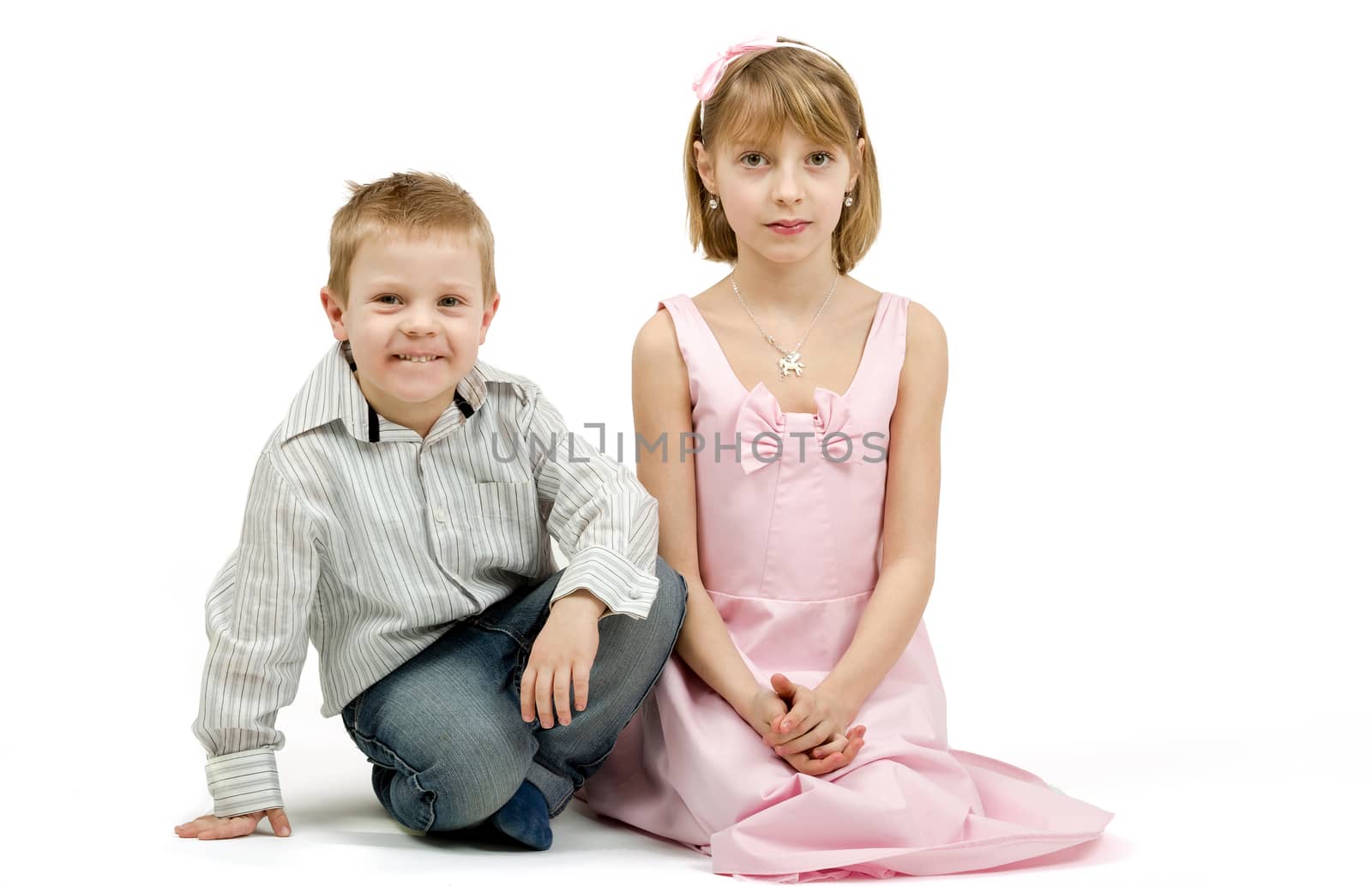 Studio portrait of siblings beautiful boy and girl by artush