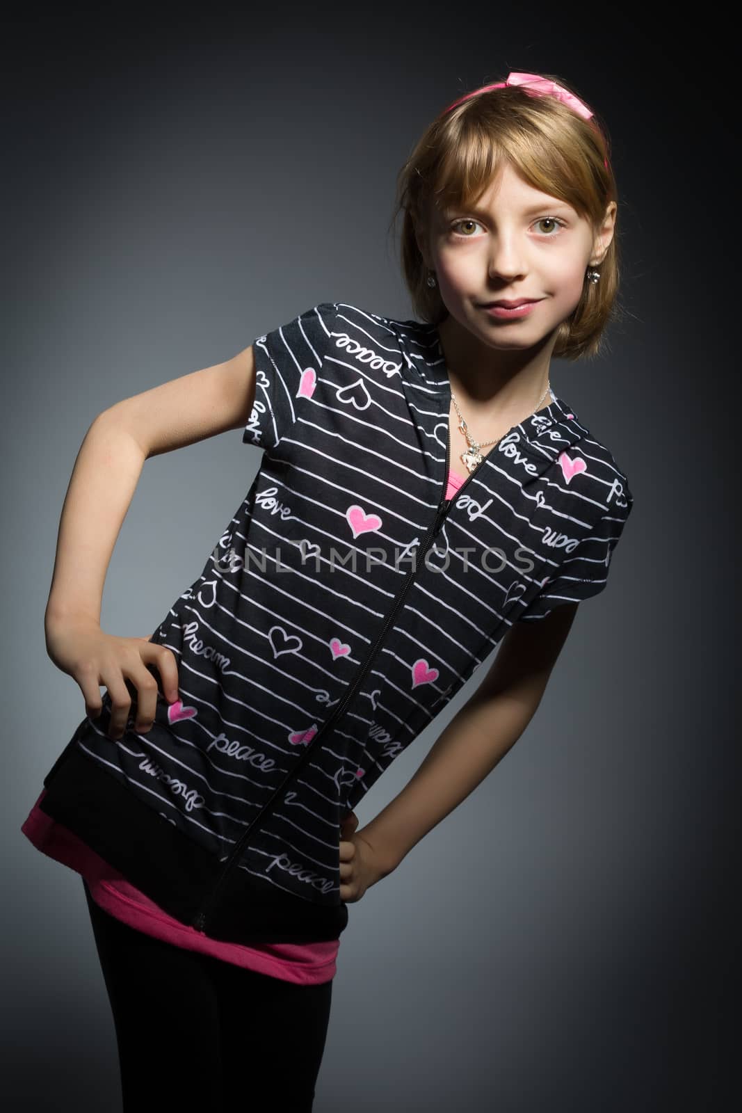 Studio portrait of young beautiful girl with nice eyes on black