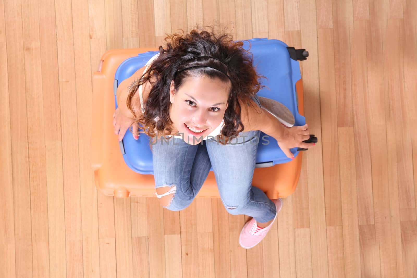 Girl sitting on suitcases	 by Spectral