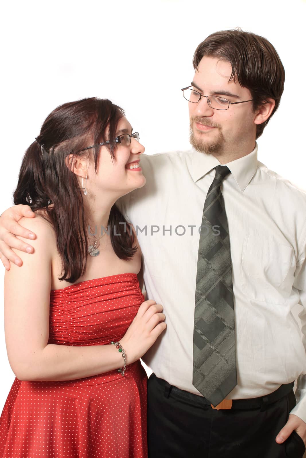 Cute young couple happy together on a white background