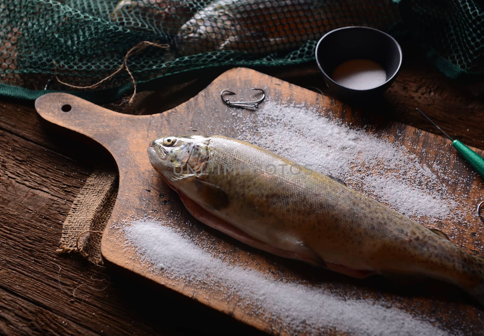 Fresh trouts on wooden background