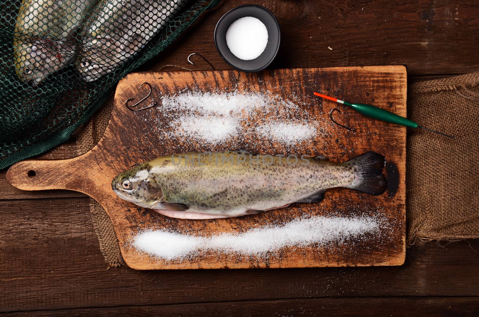 Fresh trouts on wooden background