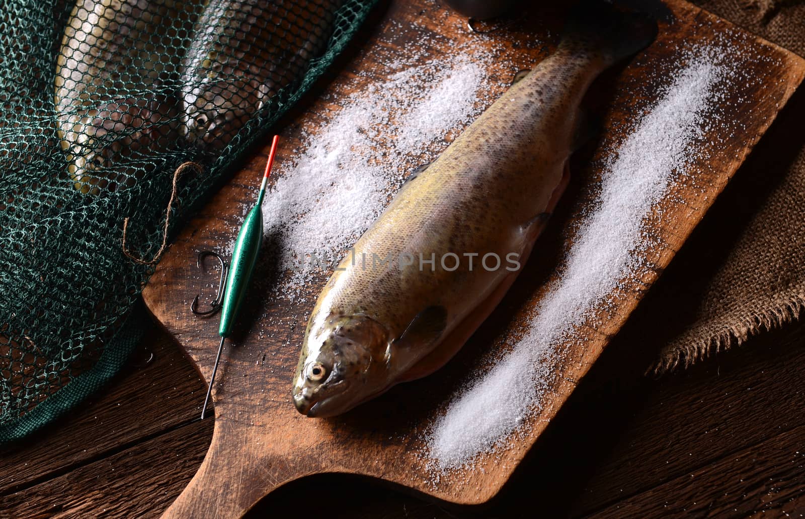 Fresh trouts on wooden background