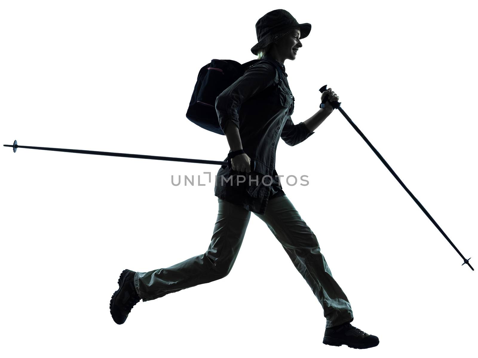 one caucasian woman trekker trekking running in silhouette studio isolated on white background