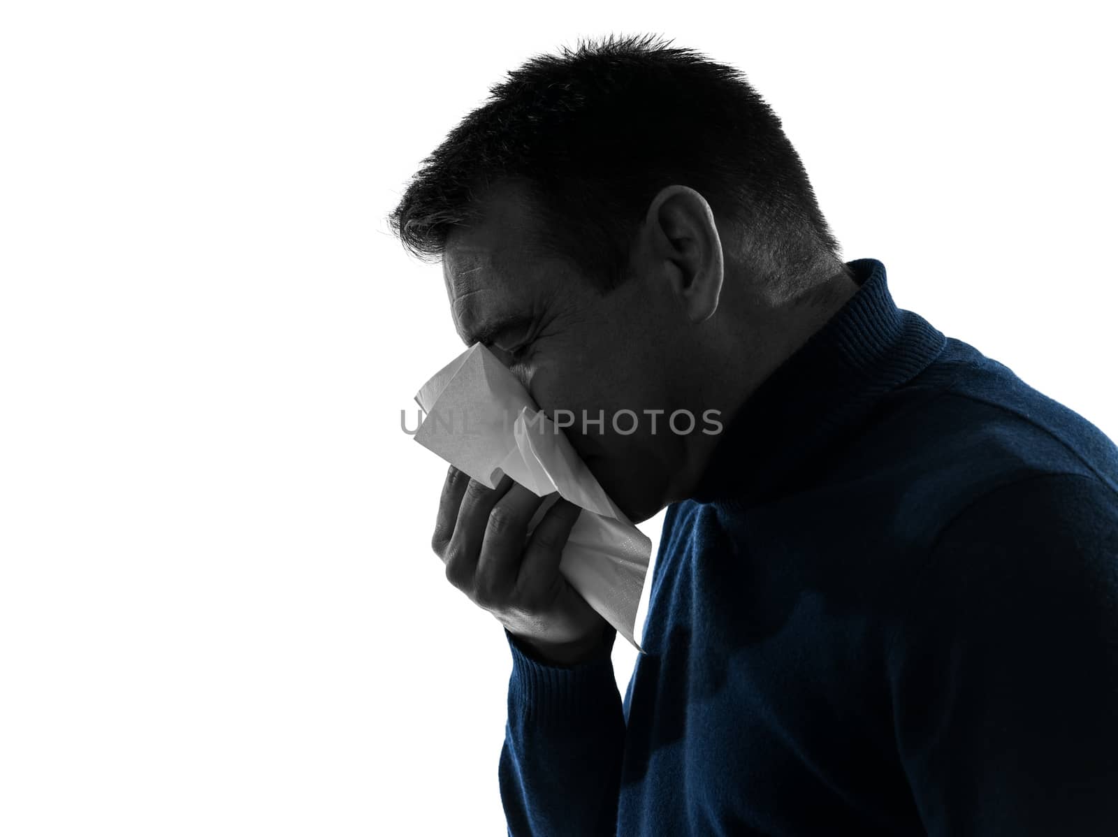 one caucasian man sneezing portrait in silhouette studio isolated on white background