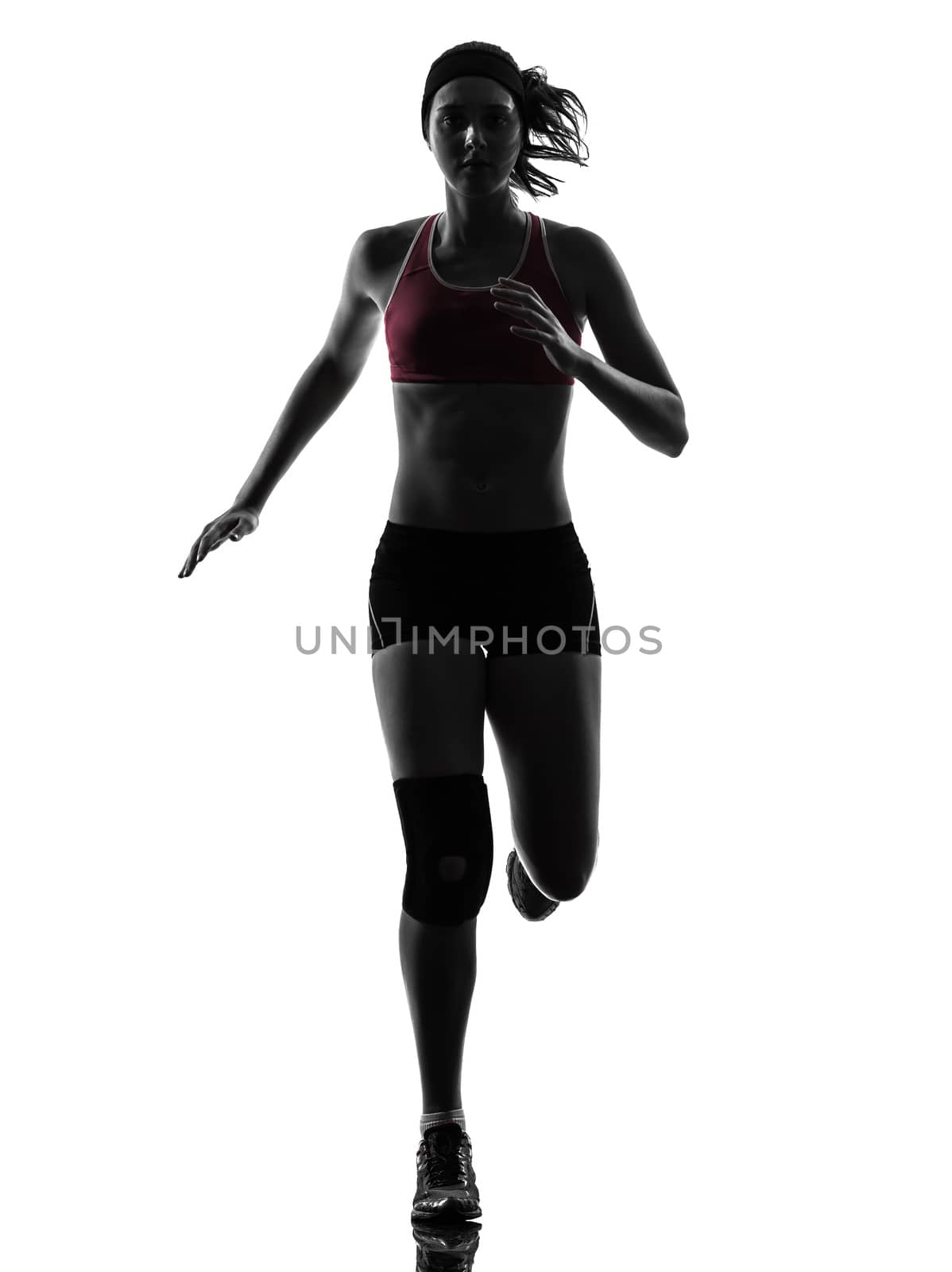 one caucasian woman runner running marathon in silhouette studio isolated on white background