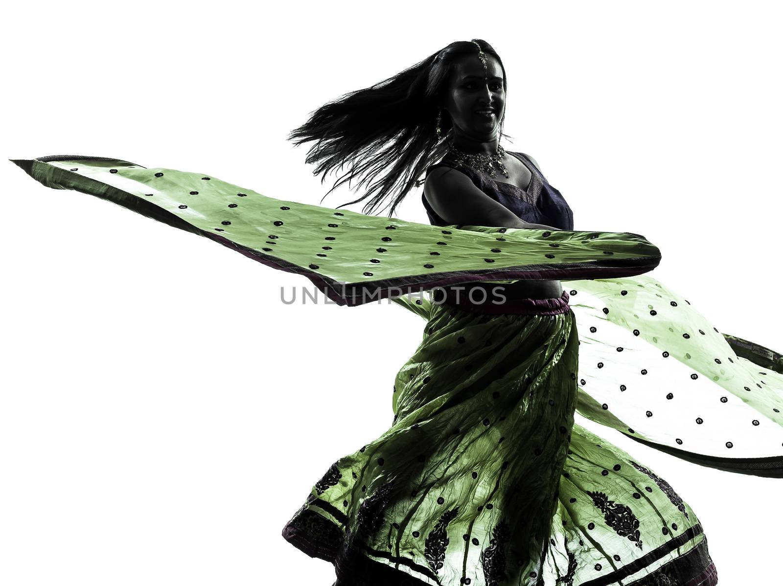 one indian woman dancer dancing in silhouette studio isolated on white background