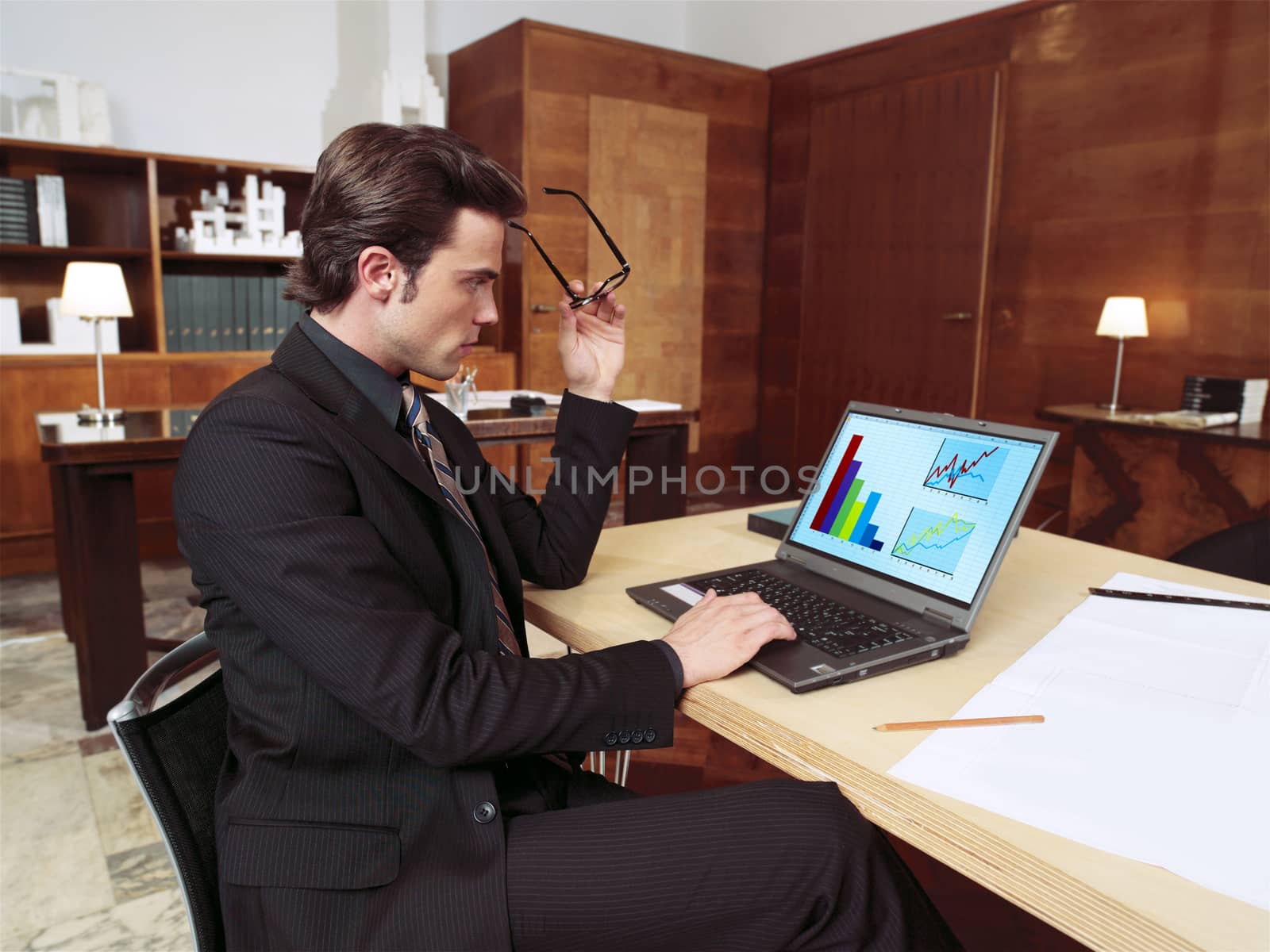 businessman with laptop in office l by toocan