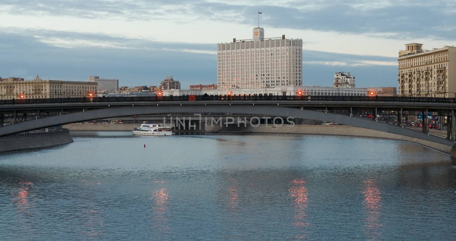  View of the building Government of the Russian Federation in Moscow by the Moscow river in twilight